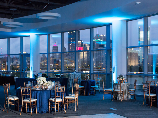 Room filled elegant round tables and chairs.