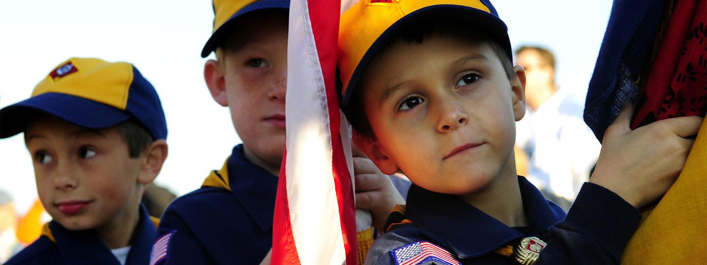 Boy scouts holding flags