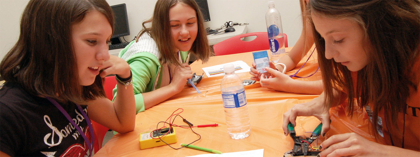 Girls working on science projects