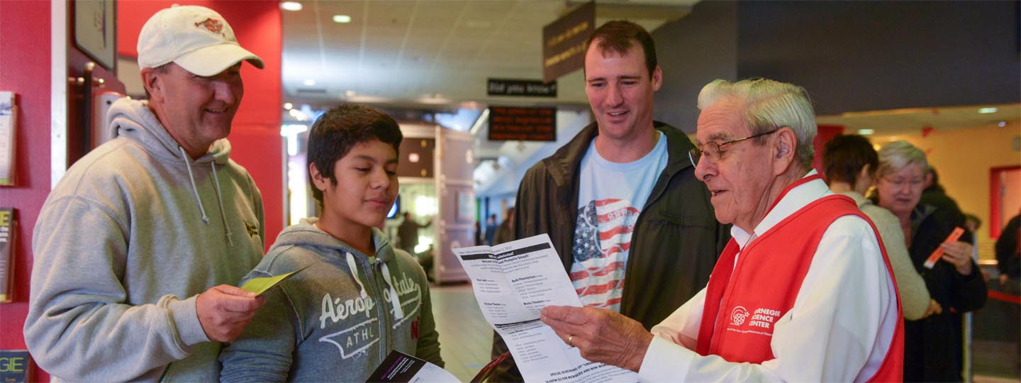 Volunteer helping visitors